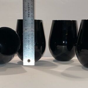 Dark blue/black stemless wine glasses.